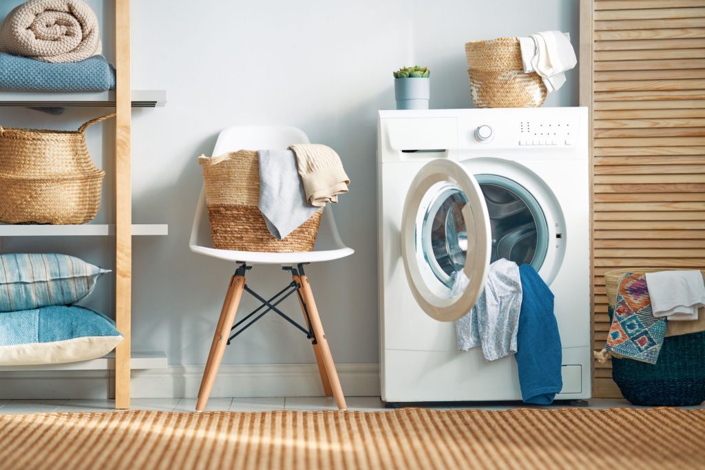 Affordable Top load washing machine in Lagos with clothes neatly arranged for laundry