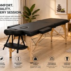 Adjustable massage bed in a modern spa treatment room with therapist preparing for a relaxing client session.