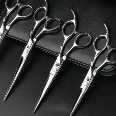 Professional hair cutting scissors with sharp stainless steel blades for salon, barber, and hairstyling use in Nigeria.